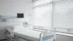 Commercial blinds installed in a hospital patient room for privacy and light control