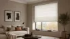 Modern living room featuring white Roman blinds, showcasing their elegant design and light-filtering functionality