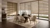 Modern dining room featuring beige zebra blinds with alternating sheer and solid fabric for adjustable light control