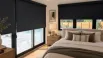 Blackout blinds covering large windows in a modern Canadian bedroom, providing privacy and light control